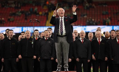 220225  Wales v Ireland, 2025 Guinness Six Nations - Musical Director Dr Hayden James conducts the crowd and choir