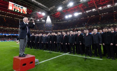 220225  Wales v Ireland, 2025 Guinness Six Nations - Musical Director Dr Hayden James conducts the crowd and choir