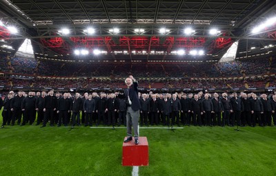 220225  Wales v Ireland, 2025 Guinness Six Nations - Musical Director Dr Hayden James conducts the crowd and choir