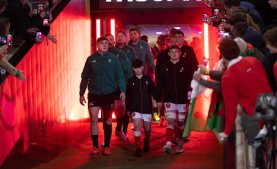 220225  Wales v Ireland, 2025 Guinness Six Nations - Dan Sheehan of Ireland and Jac Morgan of Wales with match mascot