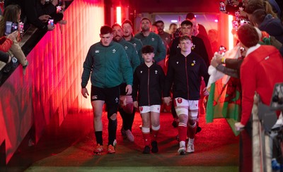 220225  Wales v Ireland, 2025 Guinness Six Nations - Dan Sheehan of Ireland and Jac Morgan of Wales with match mascot