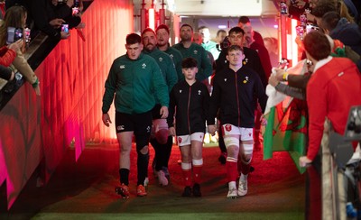 220225  Wales v Ireland, 2025 Guinness Six Nations - Dan Sheehan of Ireland and Jac Morgan of Wales with match mascot