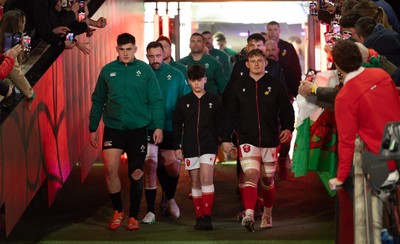 220225  Wales v Ireland, 2025 Guinness Six Nations - Dan Sheehan of Ireland and Jac Morgan of Wales with match mascot