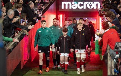 220225  Wales v Ireland, 2025 Guinness Six Nations - Dan Sheehan of Ireland and Jac Morgan of Wales with match mascot