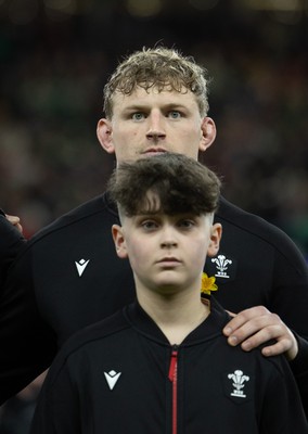 220225  Wales v Ireland, 2025 Guinness Six Nations - Jac Morgan of Wales with match mascot George Rogers