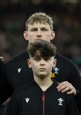 220225  Wales v Ireland, 2025 Guinness Six Nations - Jac Morgan of Wales with match mascot George Rogers