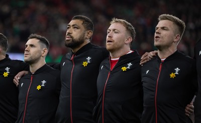 220225  Wales v Ireland, 2025 Guinness Six Nations - Tomos Williams of Wales, Taulupe Faletau of Wales, Tommy Reffell of Wales and Gareth Anscombe of Wales during the anthem