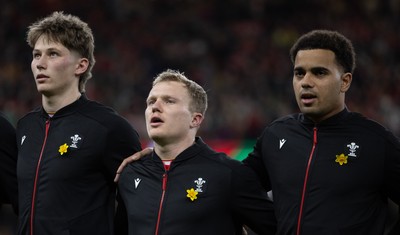 220225  Wales v Ireland, 2025 Guinness Six Nations - Ellis Mee of Wales, Blair Murray of Wales and Ben Thomas of Wales during the anthem