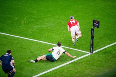 220225 - Wales v Ireland - Guinness Six Nations -  Tom Rogers of Wales beats James Lowe of Ireland to score a try 