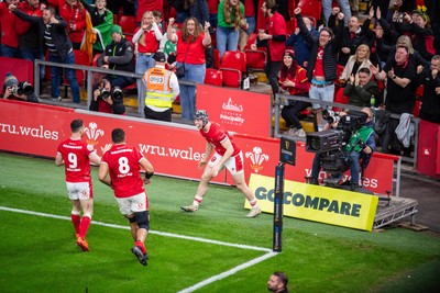 220225 - Wales v Ireland - Guinness Six Nations -  Tom Rogers of Wales celebrates scoring a try 