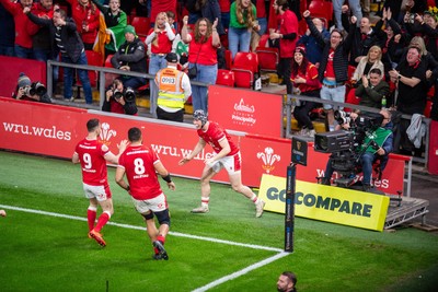 220225 - Wales v Ireland - Guinness Six Nations -  Tom Rogers of Wales celebrates scoring a try 