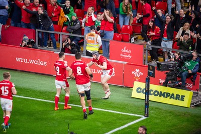 220225 - Wales v Ireland - Guinness Six Nations -  Tom Rogers of Wales celebrates scoring a try 