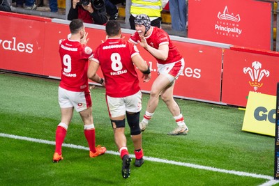 220225 - Wales v Ireland - Guinness Six Nations -  Tom Rogers of Wales celebrates scoring a try 