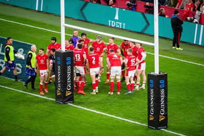 220225 - Wales v Ireland - Guinness Six Nations - Wales huddle behind the posts