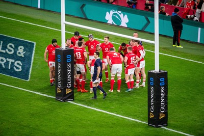 220225 - Wales v Ireland - Guinness Six Nations - Wales huddle behind the posts