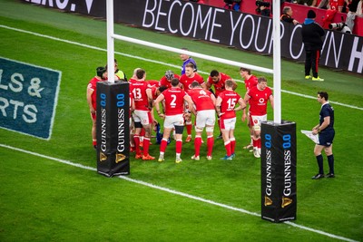 220225 - Wales v Ireland - Guinness Six Nations - Wales huddle behind the posts