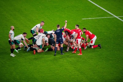 220225 - Wales v Ireland - Guinness Six Nations - Referee Christophe Ridley awards a penalty at a scrum