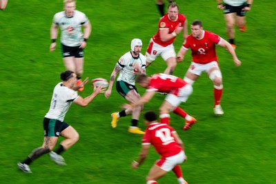 220225 - Wales v Ireland - Guinness Six Nations - Mack Hansen of Ireland passes to James Lowe of Ireland