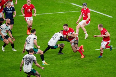 220225 - Wales v Ireland - Guinness Six Nations - Max Llewellyn of Wales is tackled by Sam Prendergast of Ireland