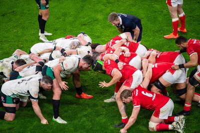 220225 - Wales v Ireland - Guinness Six Nations - Players pack down for a scrum as referee Christophe Ridley watches