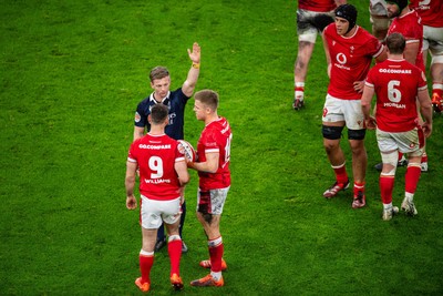 220225 - Wales v Ireland - Guinness Six Nations - Referee Christophe Ridley awards a penalty