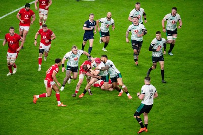 220225 - Wales v Ireland - Guinness Six Nations - Josh van der Flier of Ireland is tackled by Jac Morgan of Wales