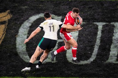 220225 - Wales v Ireland - Guinness Six Nations - Jarrod Evans of Wales is tackled by James Lowe of Ireland