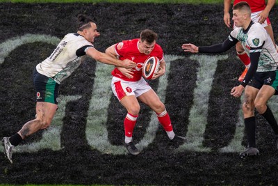 220225 - Wales v Ireland - Guinness Six Nations - Jarrod Evans of Wales is tackled by James Lowe of Ireland