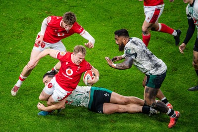 220225 - Wales v Ireland - Guinness Six Nations - Blair Murray of Wales is tackled by James Lowe of Ireland