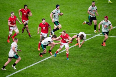 220225 - Wales v Ireland - Guinness Six Nations - Blair Murray of Wales beats the tackle of Gus McCarthy of Ireland