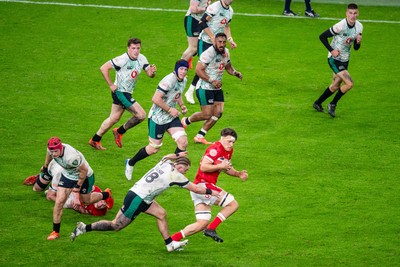 220225 - Wales v Ireland - Guinness Six Nations - Teddy Williams of Wales is tackled by Finlay Bealham of Ireland