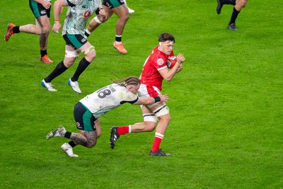 220225 - Wales v Ireland - Guinness Six Nations - Teddy Williams of Wales is tackled by Finlay Bealham of Ireland