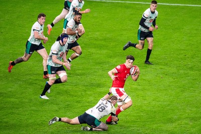 220225 - Wales v Ireland - Guinness Six Nations - Teddy Williams of Wales is tackled by Finlay Bealham of Ireland