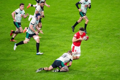 220225 - Wales v Ireland - Guinness Six Nations - Teddy Williams of Wales is tackled by Finlay Bealham of Ireland