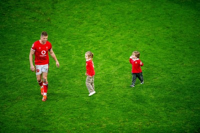 220225 - Wales v Ireland - Guinness Six Nations - Gareth Anscombe of Wales with his children on the pitch after the game