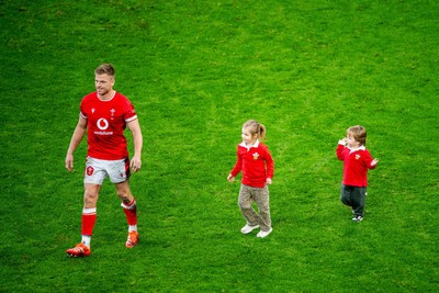 220225 - Wales v Ireland - Guinness Six Nations - Gareth Anscombe of Wales with his children on the pitch after the game