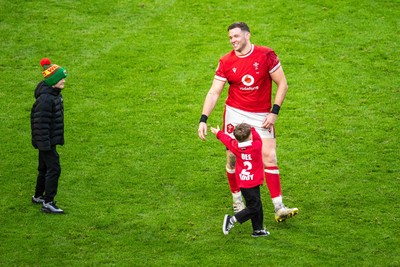 220225 - Wales v Ireland - Guinness Six Nations - Elliot Dee of Wales on the pitch with his child after the match