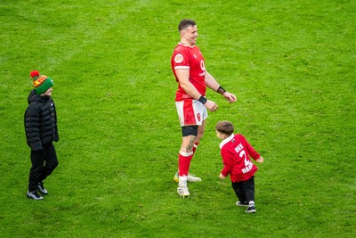 220225 - Wales v Ireland - Guinness Six Nations - Elliot Dee of Wales on the pitch with his child after the match