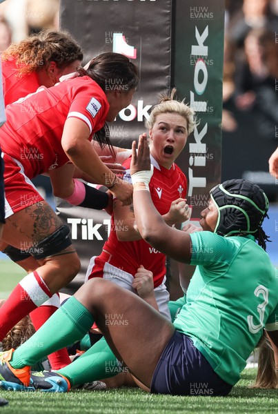 250323 - Wales v Ireland, TikToc Women’s 6 Nations - Keira Bevan of Wales celebrates after she powers over to score try