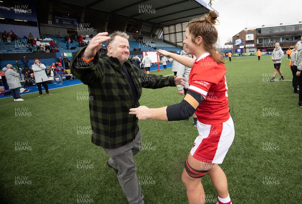 250323 - Wales v Ireland, TikToc Women’s 6 Nations - Kate Williams of Wales is embraced by father Gareth at the end of the match after making her debut