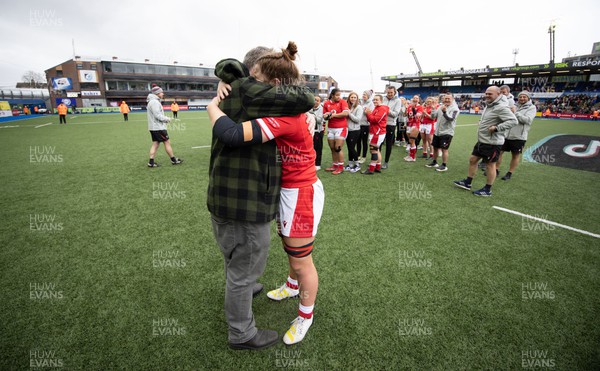 250323 - Wales v Ireland, TikToc Women’s 6 Nations - Kate Williams of Wales is embraced by father Gareth at the end of the match after making her debut