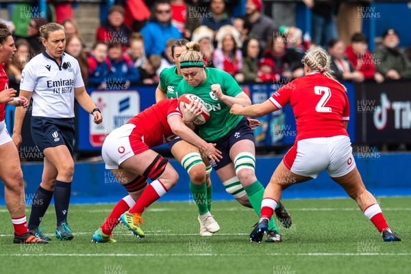 250323 - Wales v Ireland - TikTok Women's Six Nations - Sam Monaghan  of Ireland is tackled by Abbie Fleming of Wales