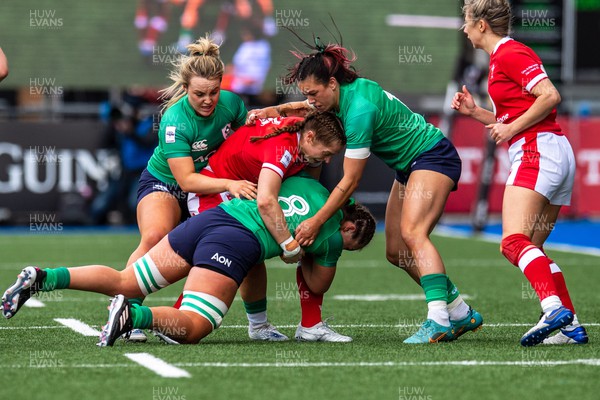 250323 - Wales v Ireland - TikTok Women's Six Nations - Brittany Hogan  of Ireland is tackled by Lisa Neuman of Wales