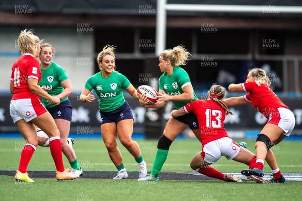 250323 - Wales v Ireland - TikTok Women's Six Nations - Vicky Irwin  of Ireland is tackled by Hannah Jones of Wales