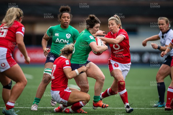 250323 - Wales v Ireland - TikTok Women's Six Nations - Deirbhile Nic A Bhaird  of Ireland is tackled by Kerin Lake of Wales and Hannah Jones of Wales
