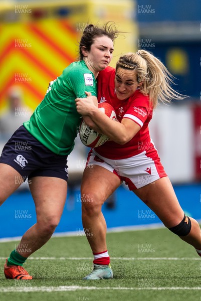 250323 - Wales v Ireland - TikTok Women's Six Nations - Deirbhile Nic A Bhaird  of Ireland is tackled by Courtney Keight of Wales
