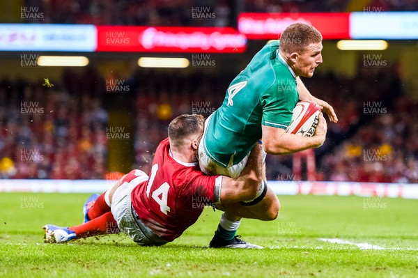 310819 - Wales v Ireland, Under Armour Summer Series - RWC Warmup - Andrew Conway of Ireland is tackled by Owen Lane of Wales 