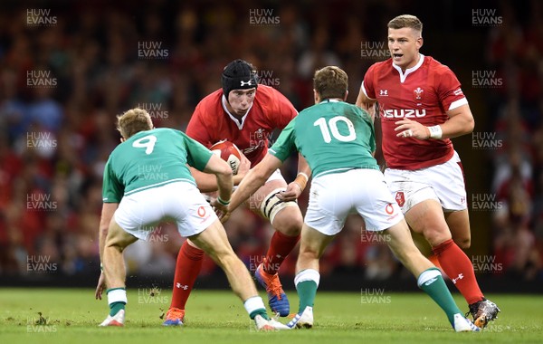 310819 - Wales v Ireland - Under Armour Series - Adam Beard of Wales is tackled by Kieran Marmion and Jack Carty of Ireland
