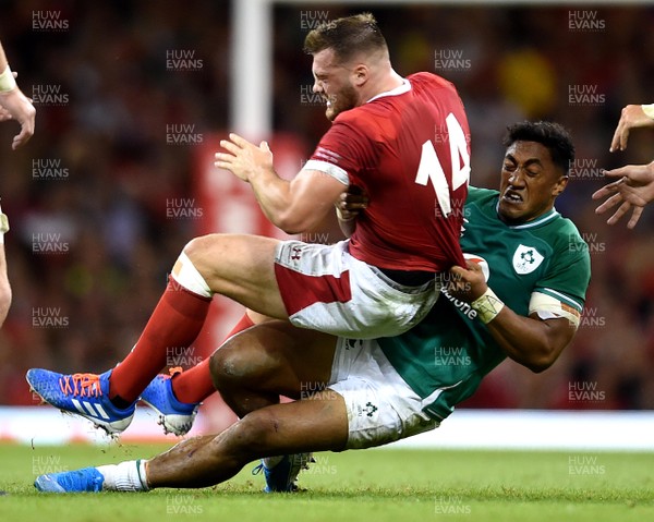 310819 - Wales v Ireland - Under Armour Series - Owen Lane of Wales is tackled by Bundee Aki of Ireland
