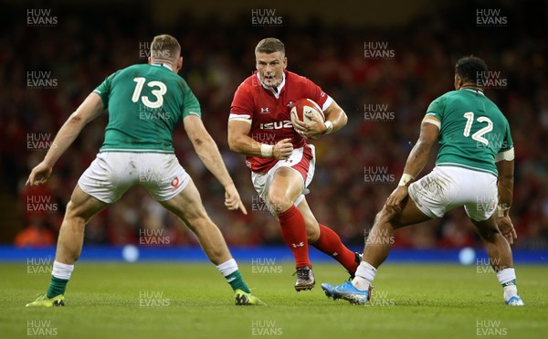 310819 - Wales v Ireland - Under Armour Summer Series - RWC Warm Up - Scott Williams of Wales is challenged by Chris Farrell and Bundee Aki of Ireland